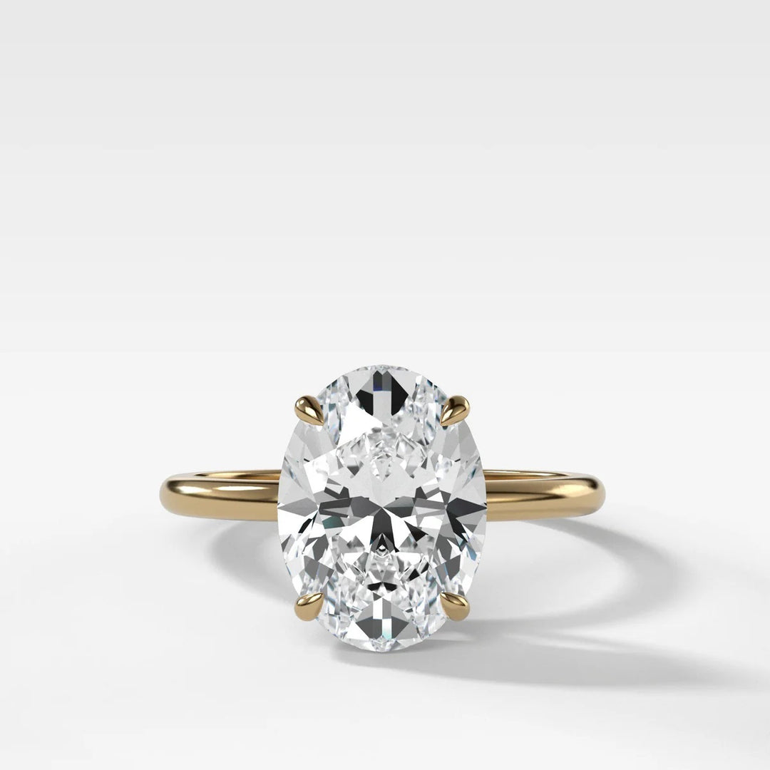 2.50ct elongated oval lab-grown diamond solitaire ring in 14k yellow gold with whisper thin band, handcrafted in NYC Diamond District