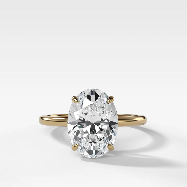 2.50ct elongated oval lab-grown diamond solitaire ring in 14k yellow gold with whisper thin band, handcrafted in NYC Diamond District