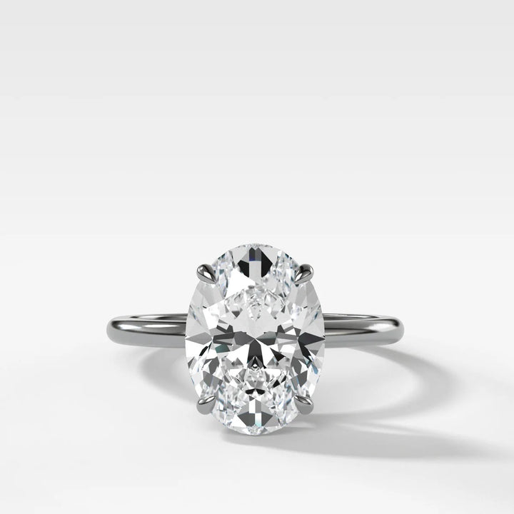 2.50ct oval lab-grown diamond solitaire set in polished 14k white gold, front view showing brilliance