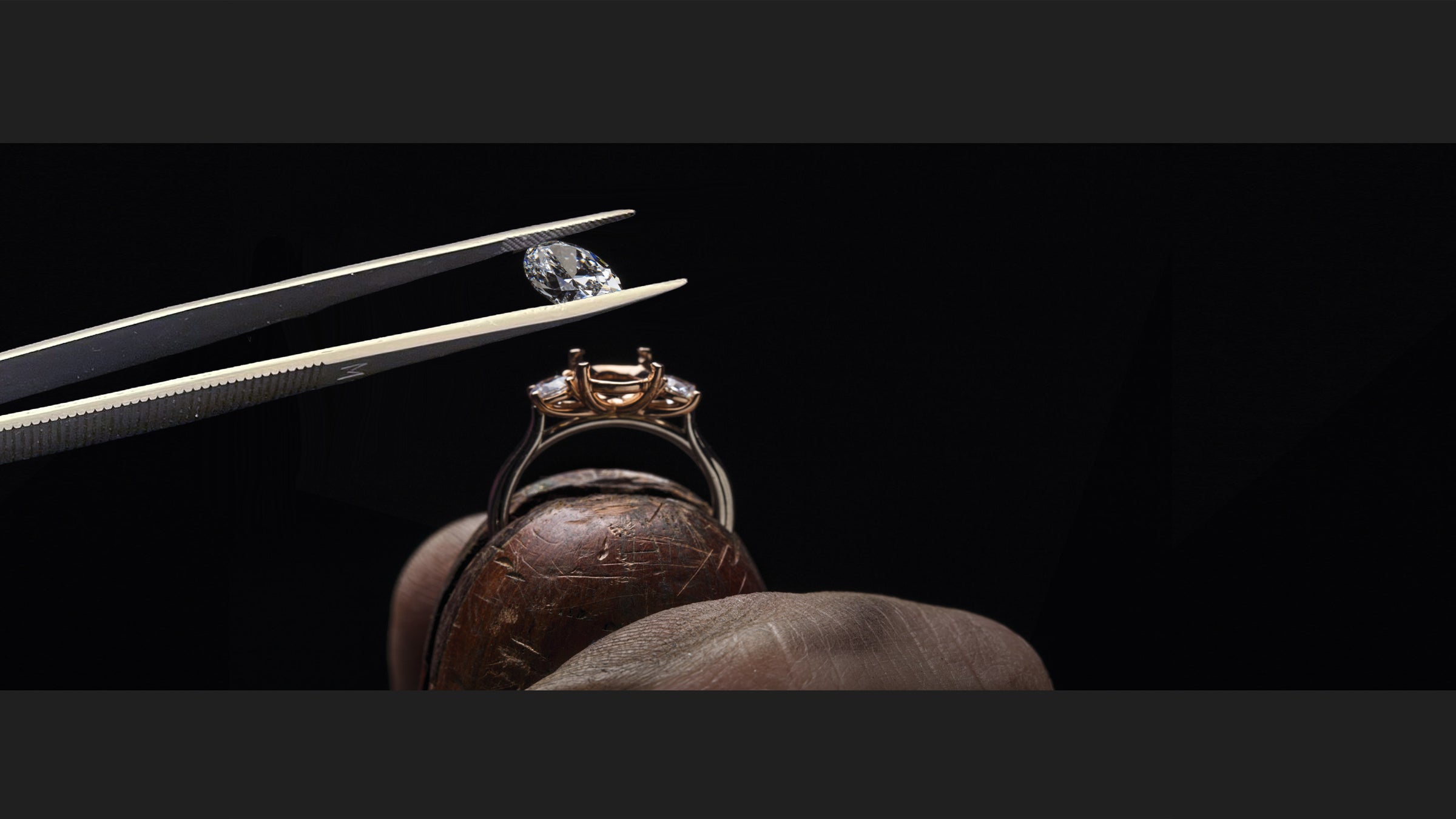 Jeweler hand-setting a diamond ring in NYC Diamond District atelier