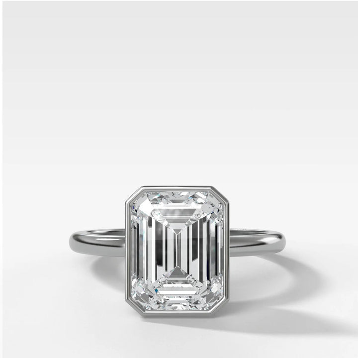 Platinum bezel set engagement ring with emerald cut lab-grown diamond, handcrafted in New York Diamond District