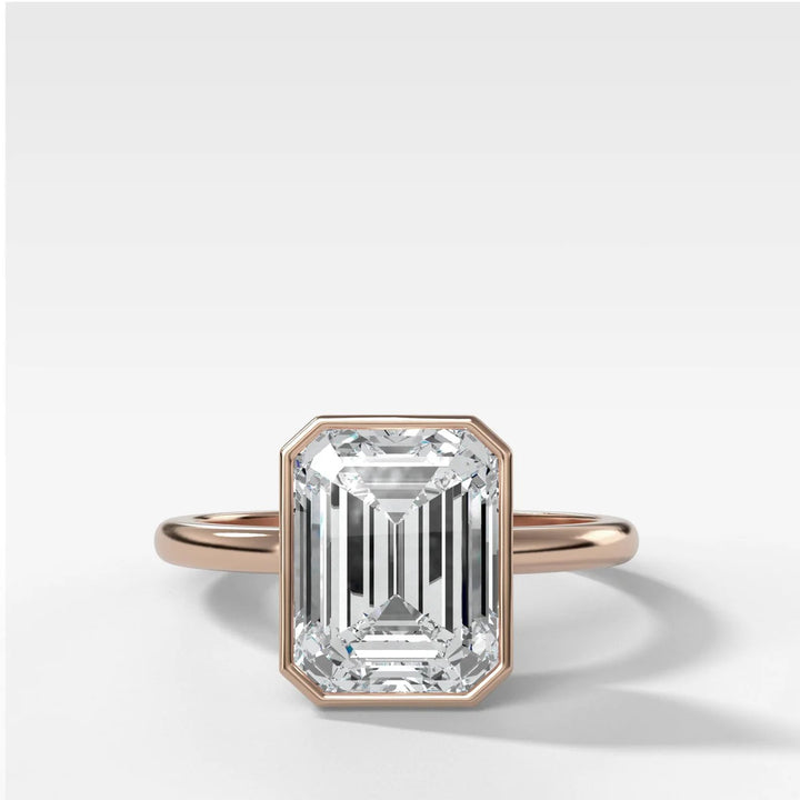 14k rose gold emerald cut diamond bezel engagement ring, showing warm pink gold tone and secure setting