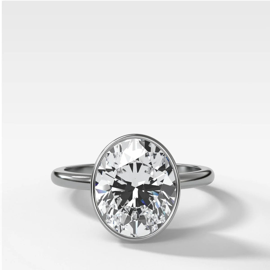 Platinum bezel set engagement ring with oval lab-grown diamond, handcrafted in New York Diamond District