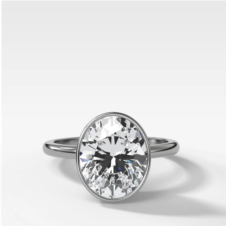 Platinum bezel set engagement ring with oval lab-grown diamond, handcrafted in New York Diamond District